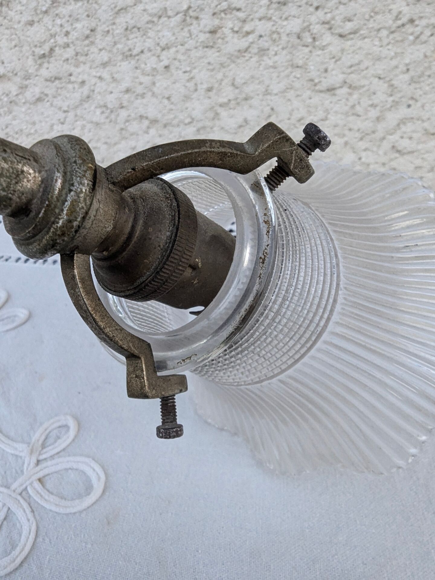 Vintage wall sconce in brass with Holophane glass tulip.
