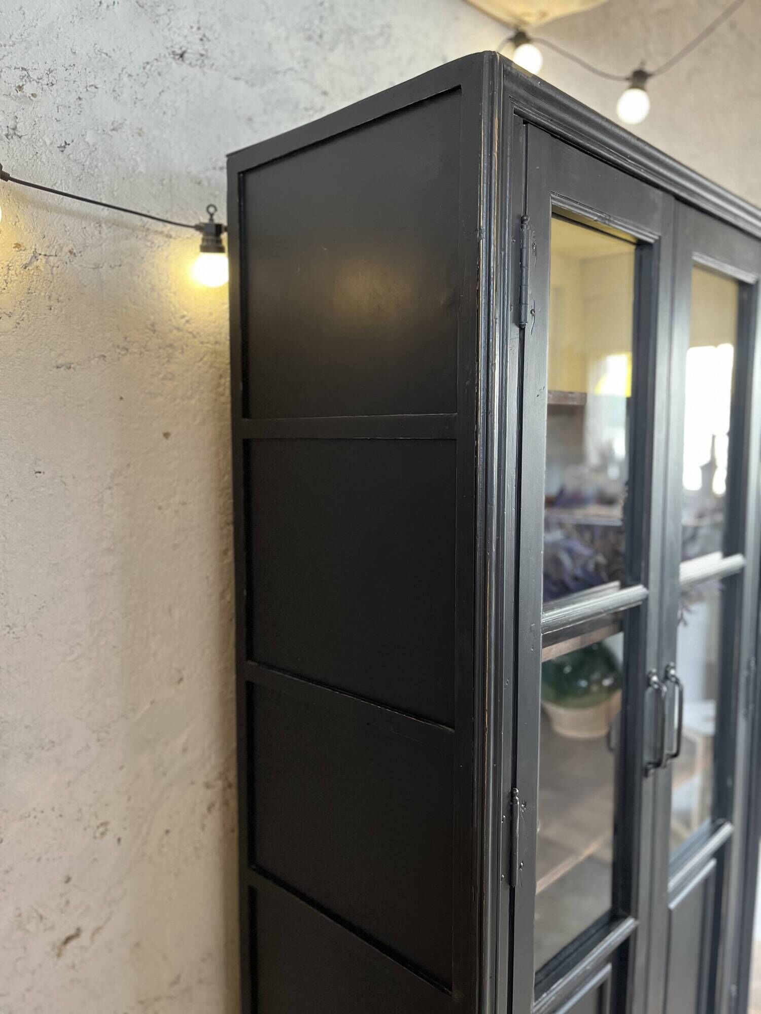 Aged patinated black display cabinet