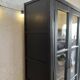 Aged patinated black display cabinet