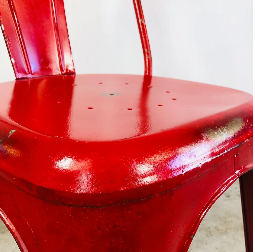 Set of four low chairs in red steel