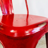Set of four low chairs in red steel