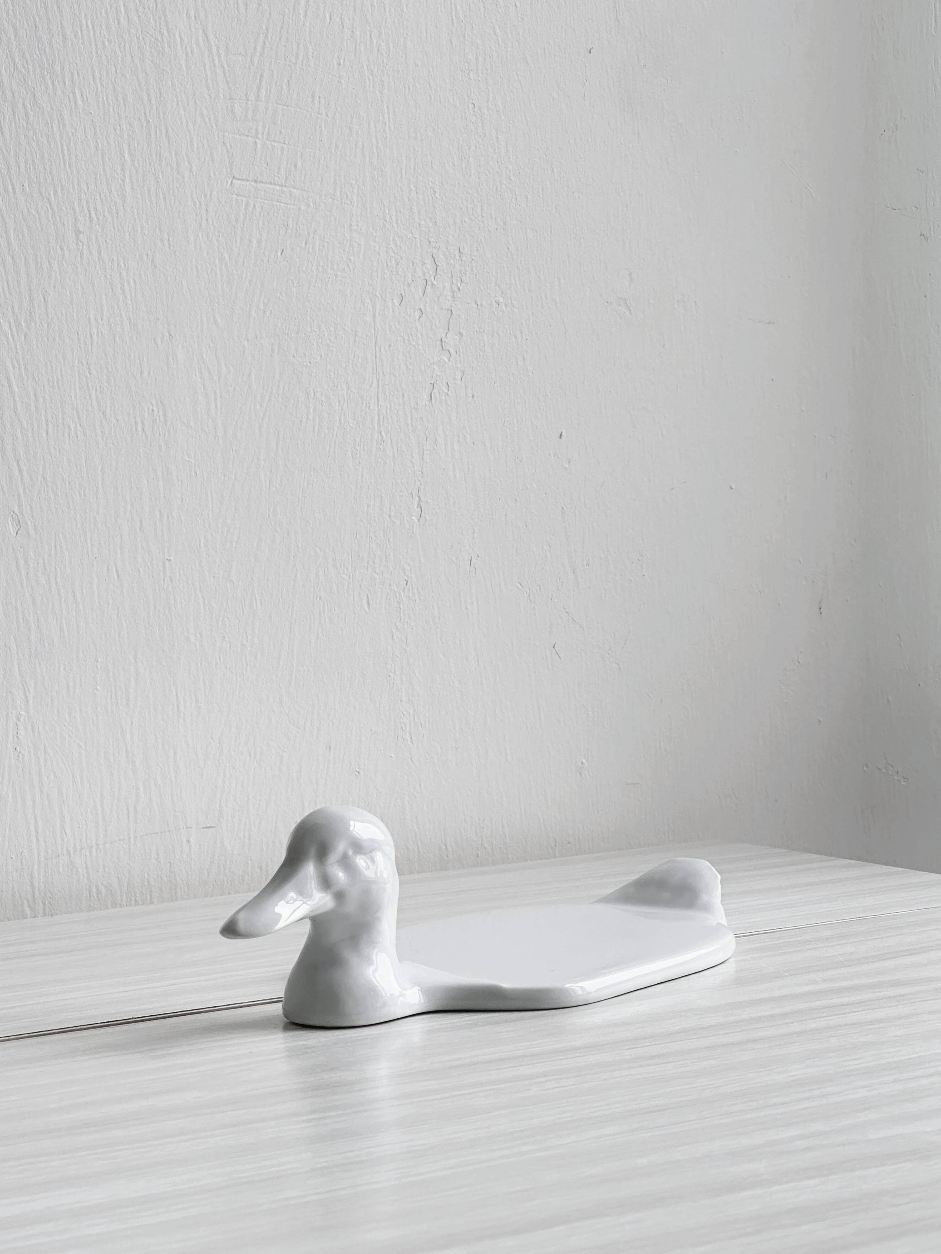 White porcelain dish in the shape of a duck.