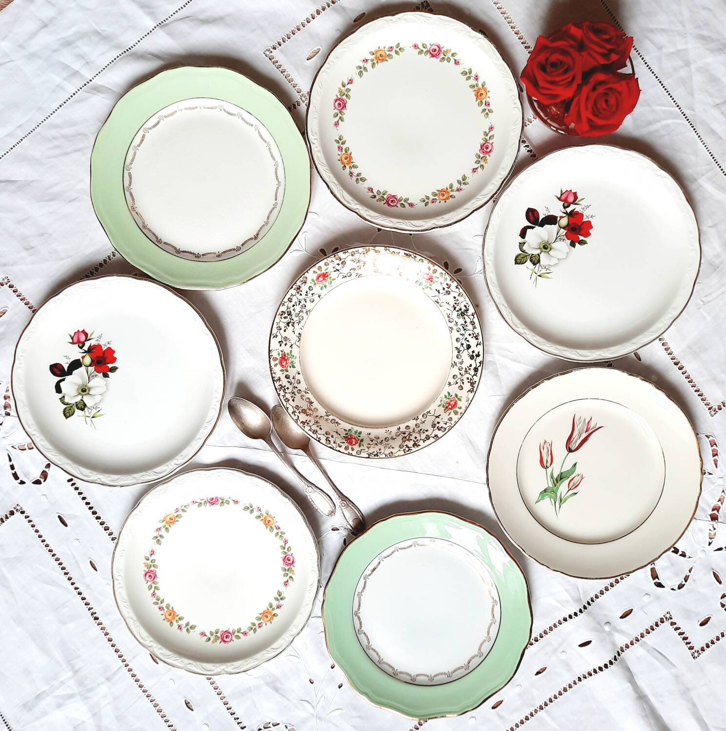 Old mismatched earthenware dessert plates with gold accompanied by a dish