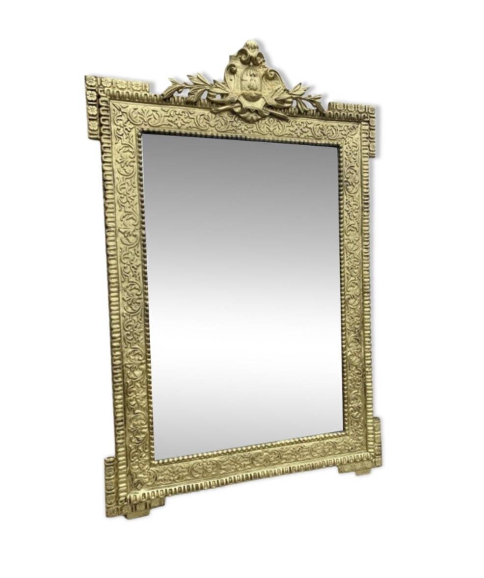19th-century antique mirror in carved gilded wood, Napoleon style.
