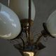 Paavo Tynell for Idman Oy, three-branch chandelier in brass and glass, mid-century, 1940s.