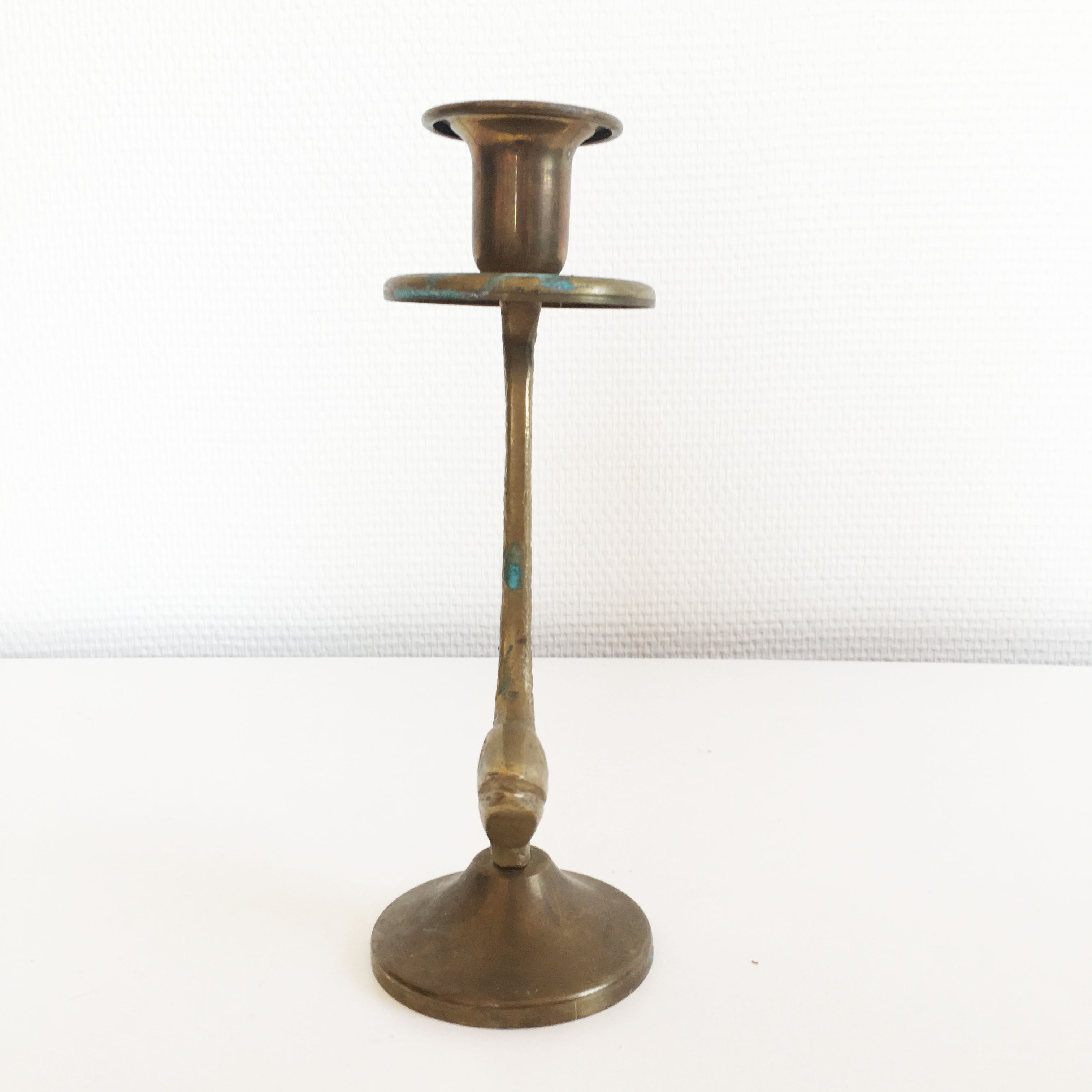 Old golden brass fish candlestick