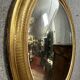 Oval mirror called “witch’s eye” in gilded wood in Louis XVI style circa 1850