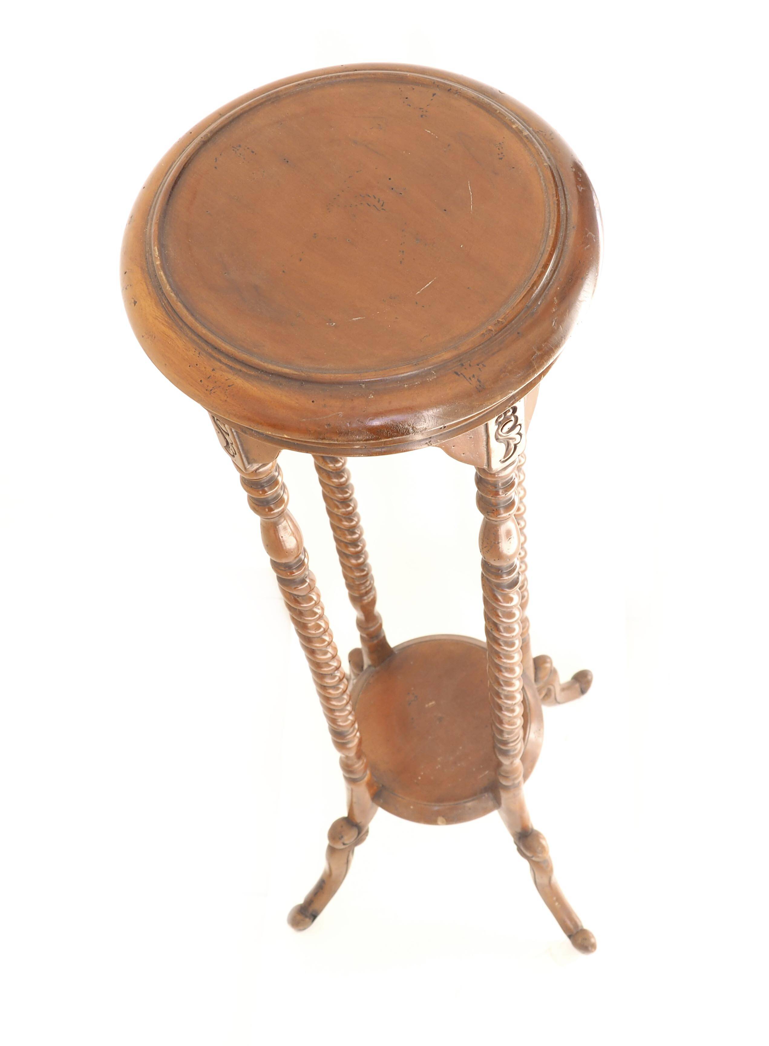 Turned cherry wood pedestal table