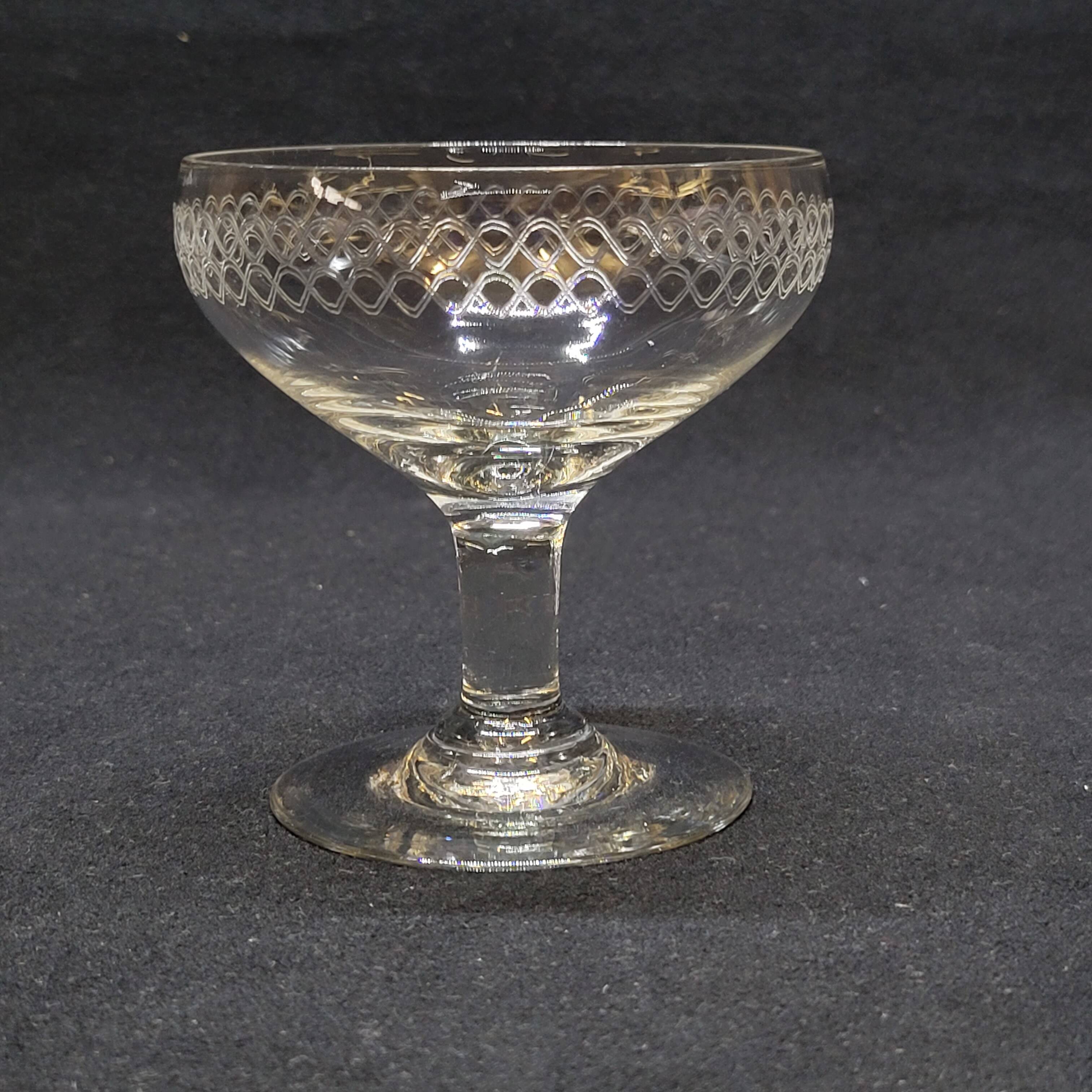 12 old champagne glasses in blown and engraved glass