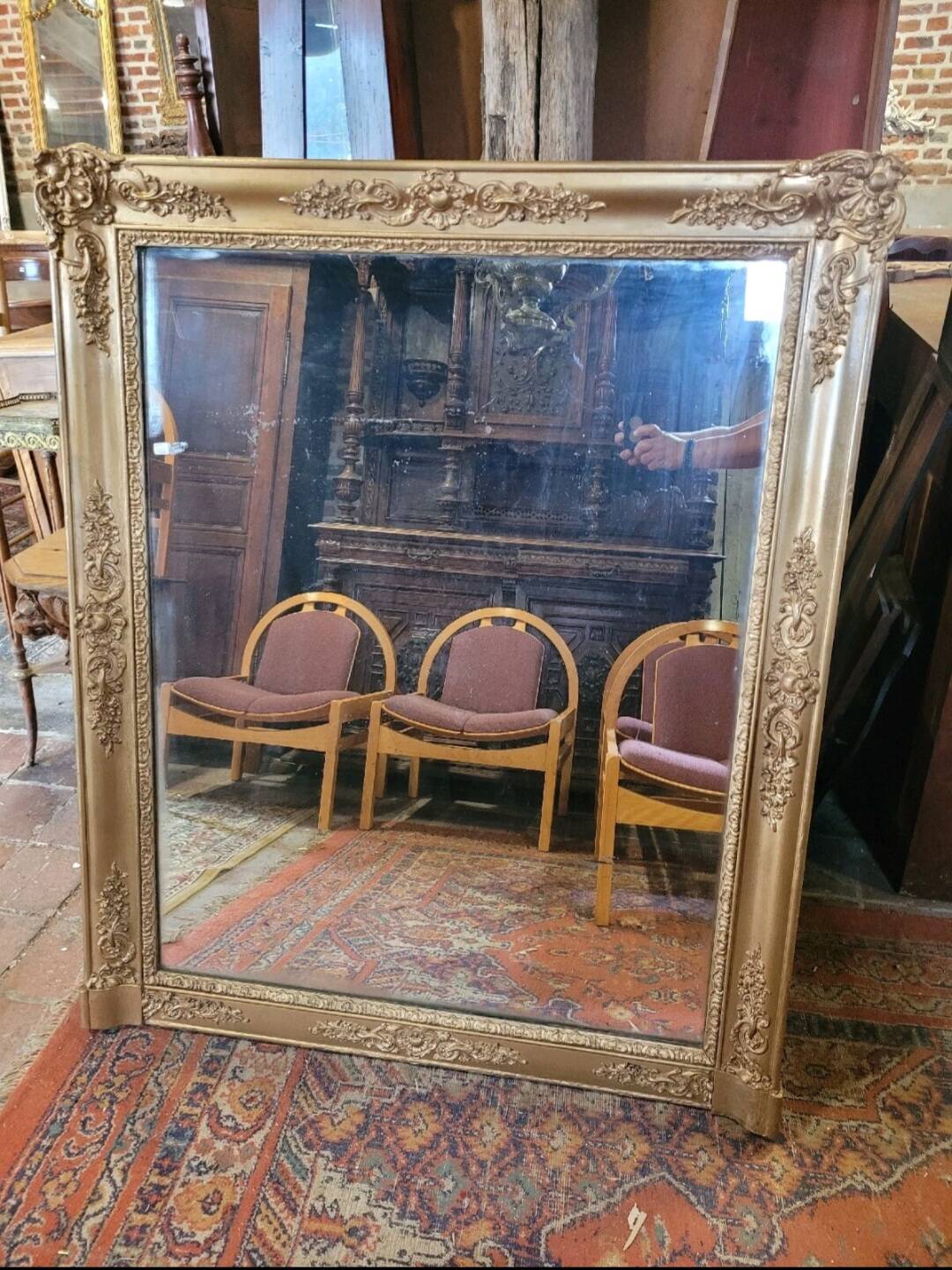Antique gilded mirror from the 19th century, mercury mirror.