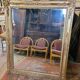 Antique gilded mirror from the 19th century, mercury mirror.