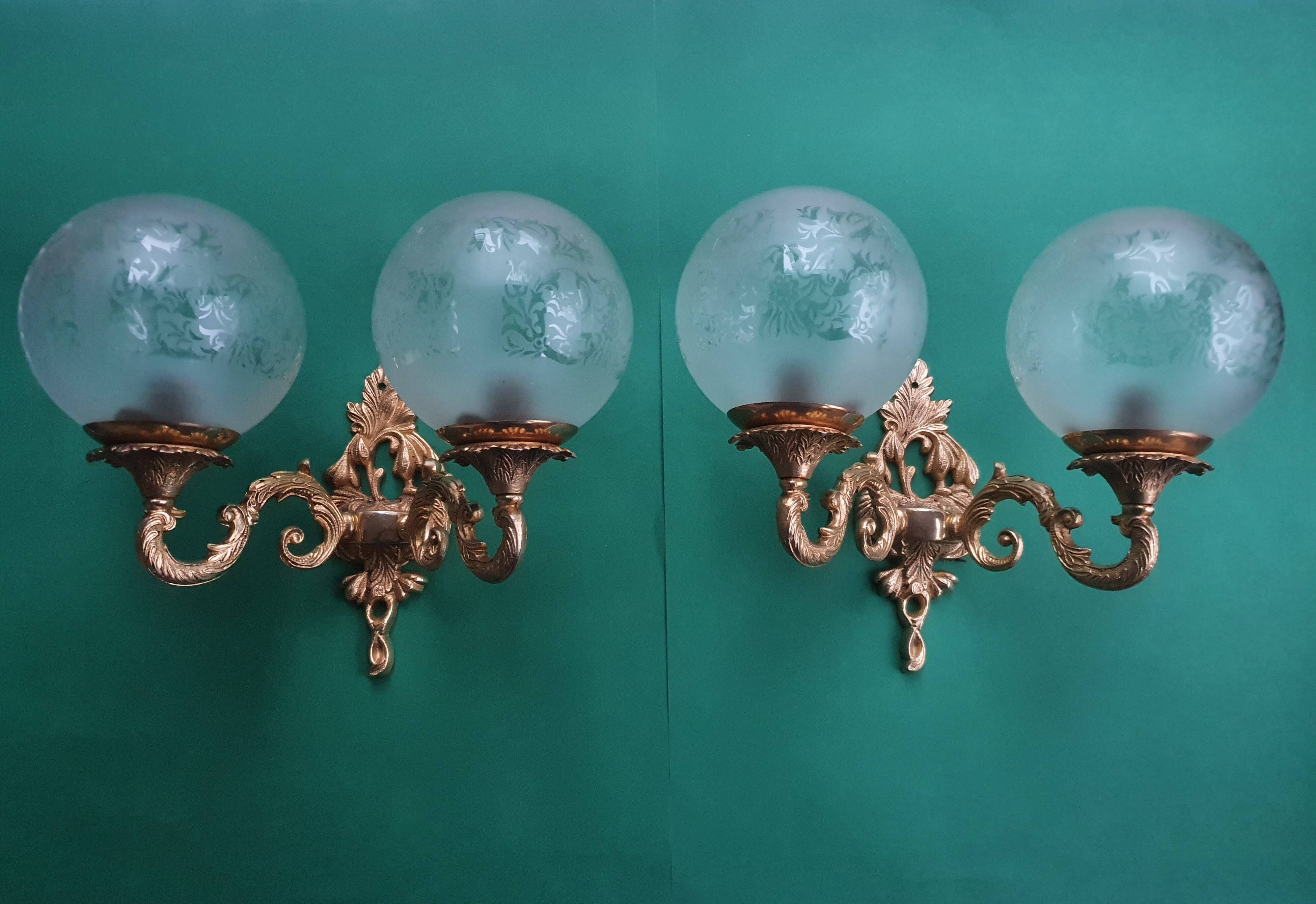 Pair of large double-light wall sconces in vintage brass and glass