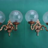 Pair of large double-light wall sconces in vintage brass and glass