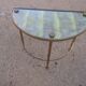 Pair of sofa tips, gilded bronze and 50s glass
