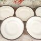 Lot de 9 assiettes creuses en porcelaine de Limoges Haviland frise florale bleu nuit et or