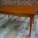 Teak dining table design by Johannes Andersen for Samcom 60s