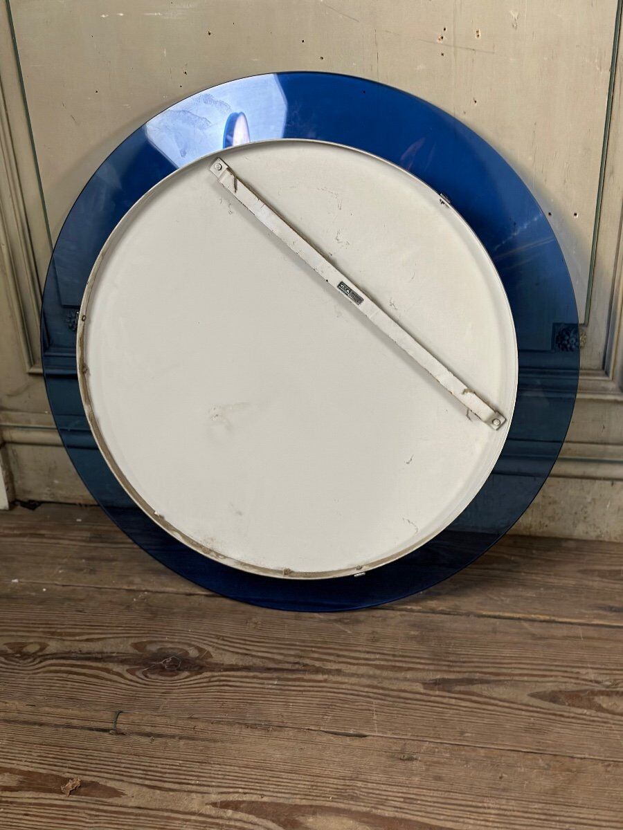 Mirror framed by a blue glass circle, italy circa 1950