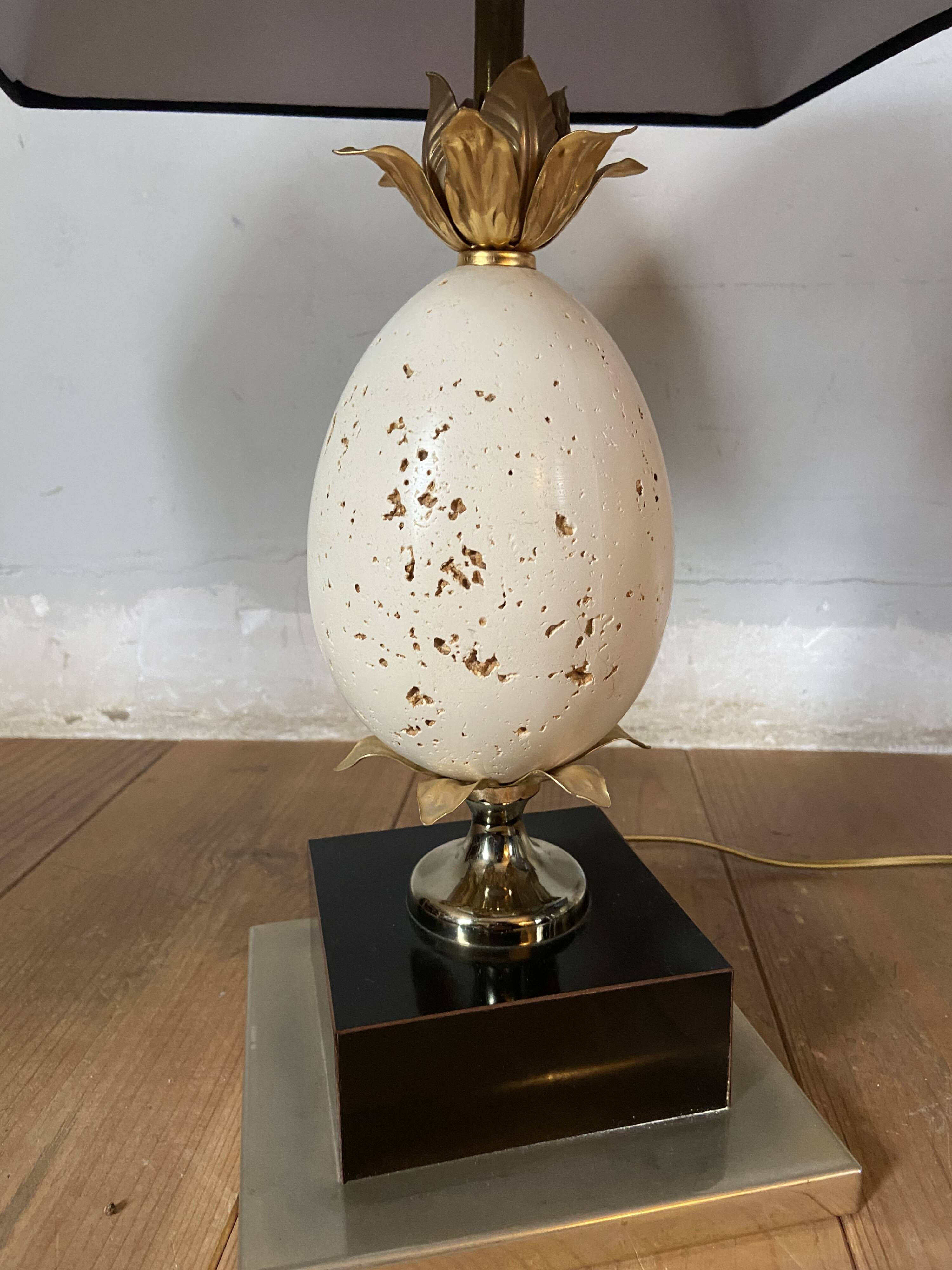 Pair of designer ostrich egg lamps in travertine from maison barbier