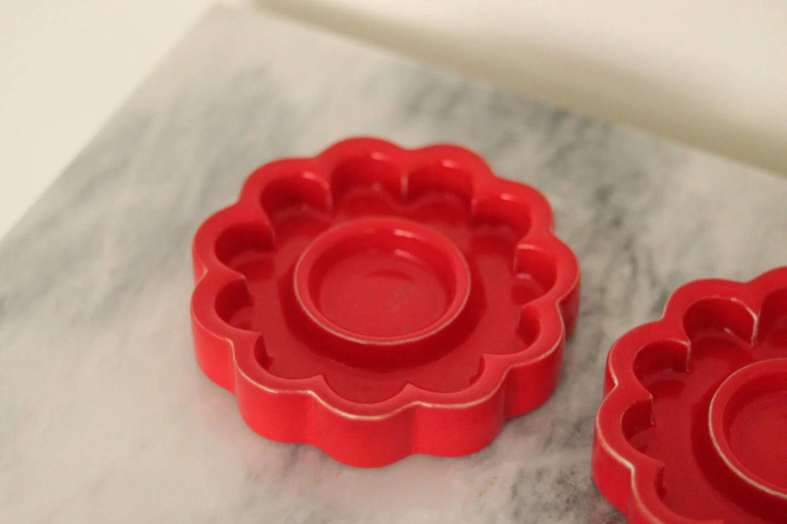 Pair of red Swedish candle holders designed by Gustavsberg