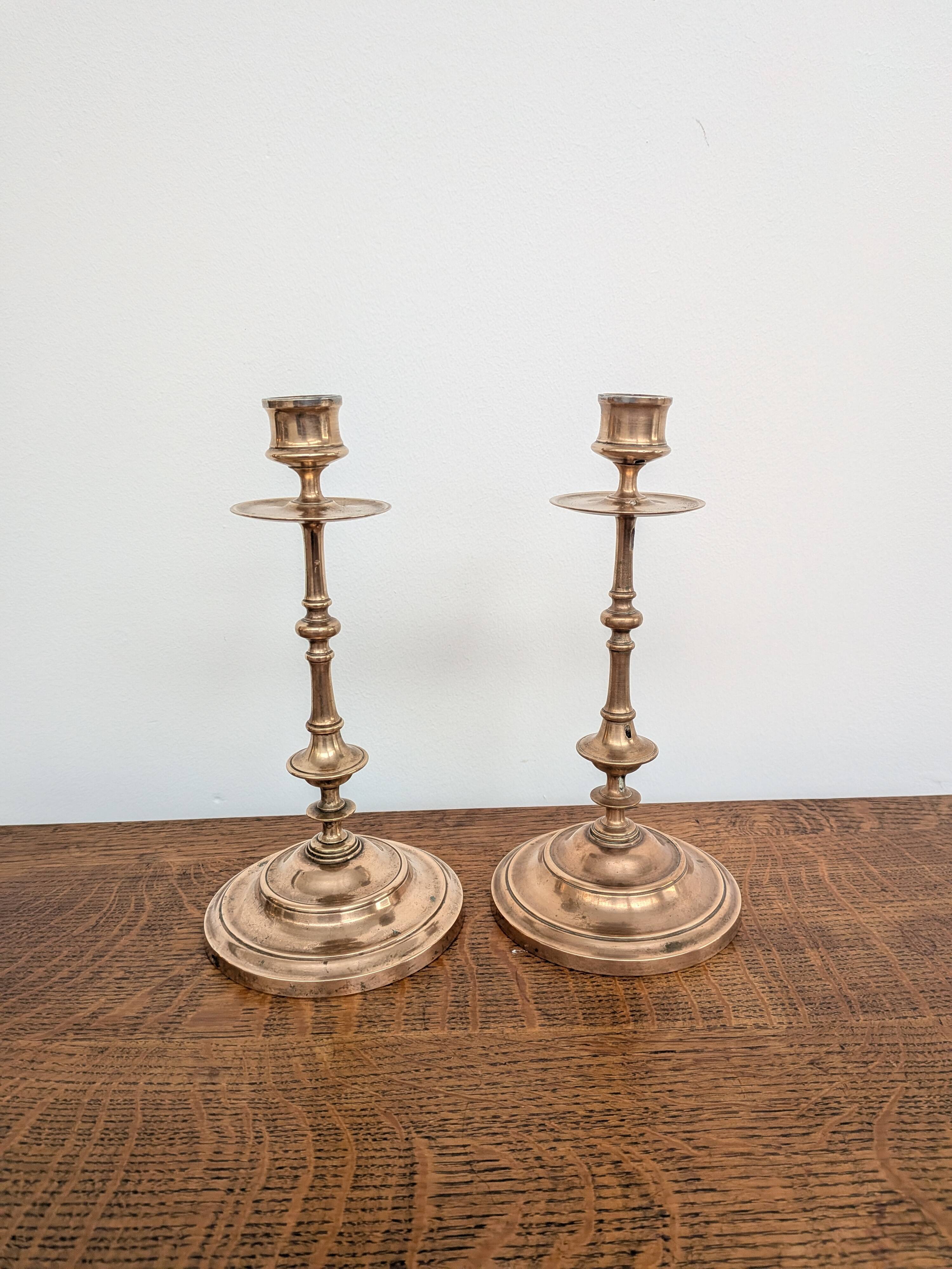 Pair of antique turned rose brass candlesticks (24 cm)