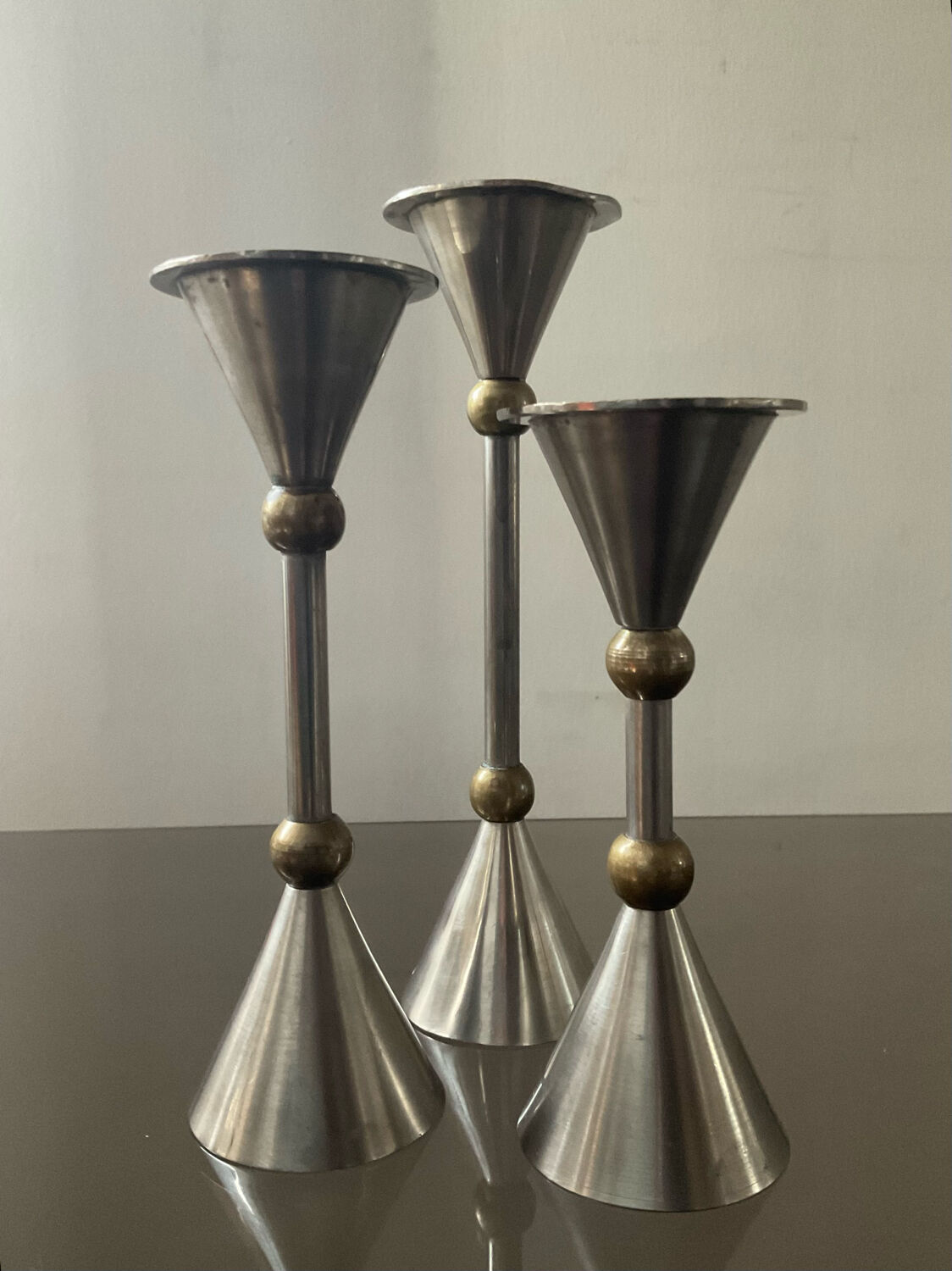Trio of vintage metal and bronze candle holders