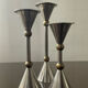 Trio of vintage metal and bronze candle holders