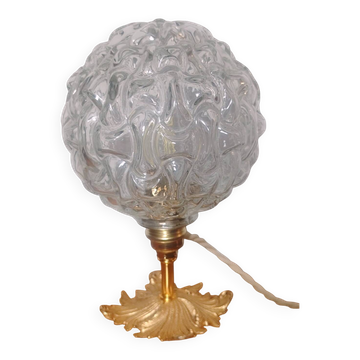 Textured globe lamp on bronze floor