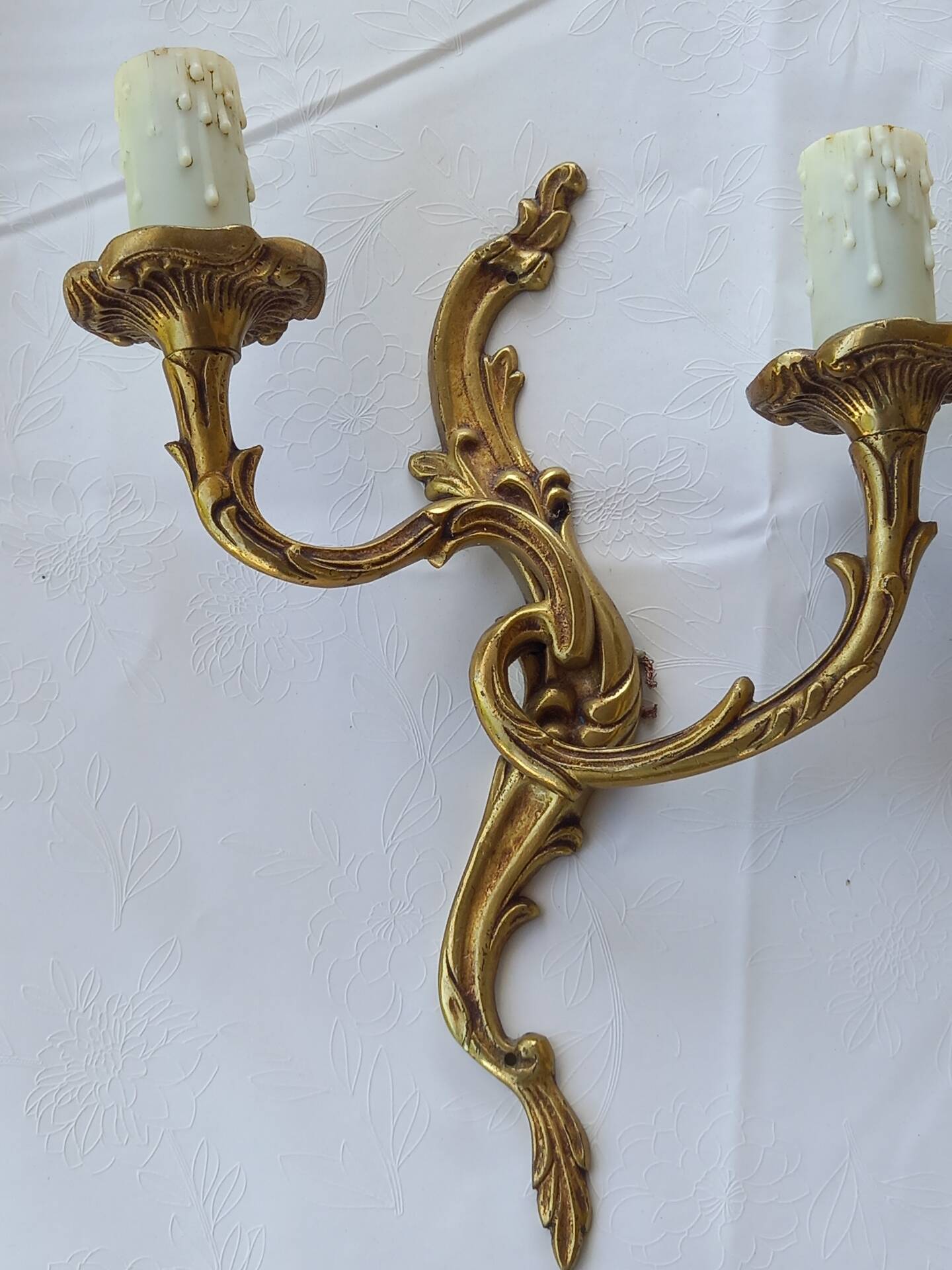 Old pairs of bronze wall sconces