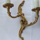 Old pairs of bronze wall sconces