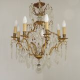 French Louis XV chandelier with 8 lights in gilded bronze, glass and crystal.