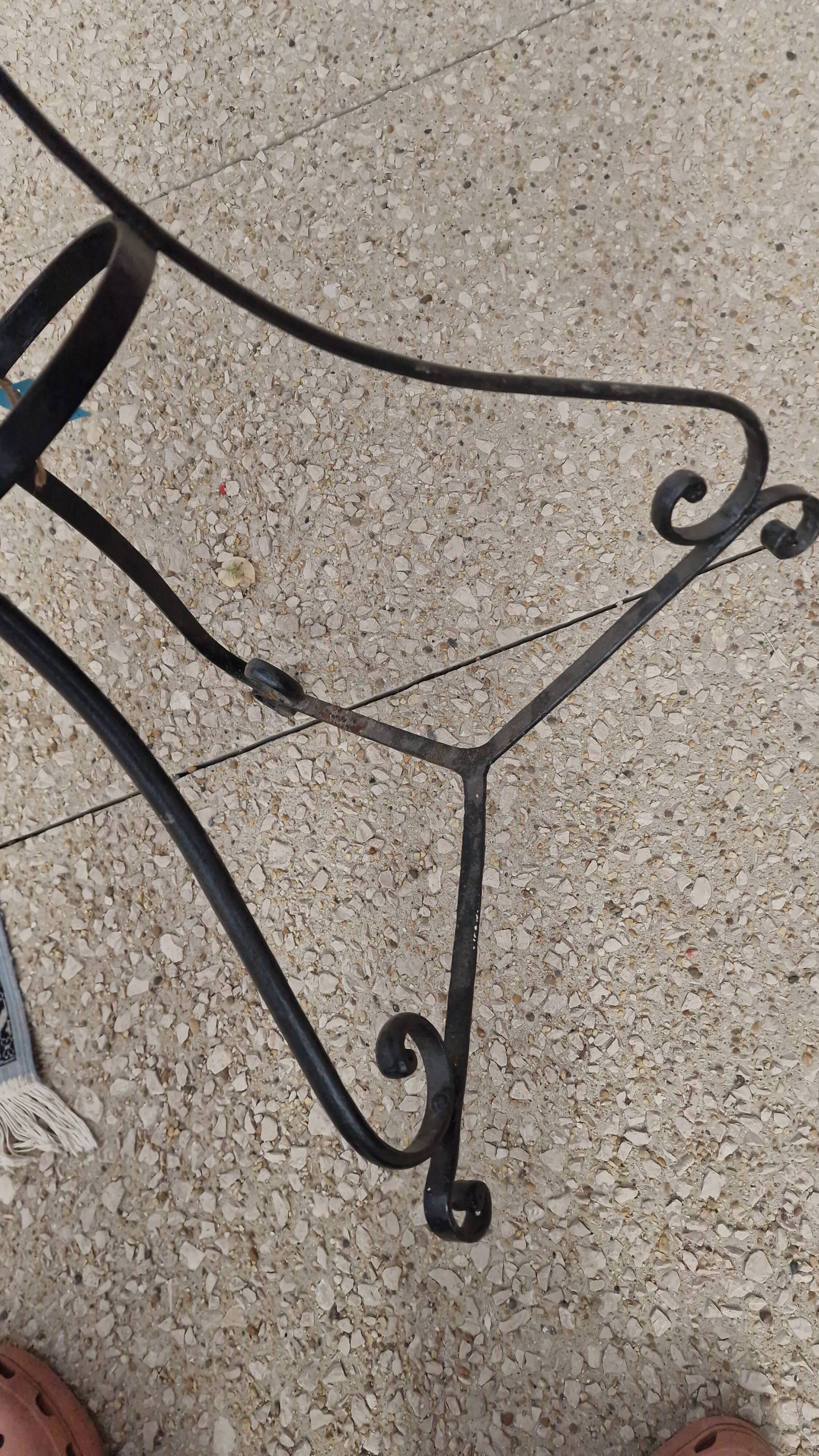 Round wrought iron and zinc bistro table