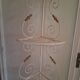 Cream and brass corner bakery shelf in wrought iron