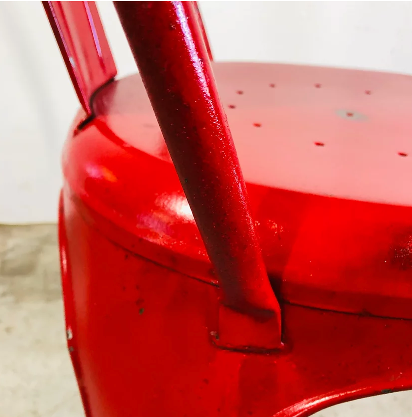 Set of four low chairs in red steel