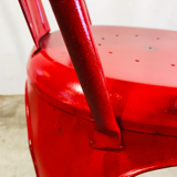 Set of four low chairs in red steel