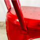 Ensemble de quatre chaises basses en acier rouge