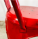 Set of four low chairs in red steel