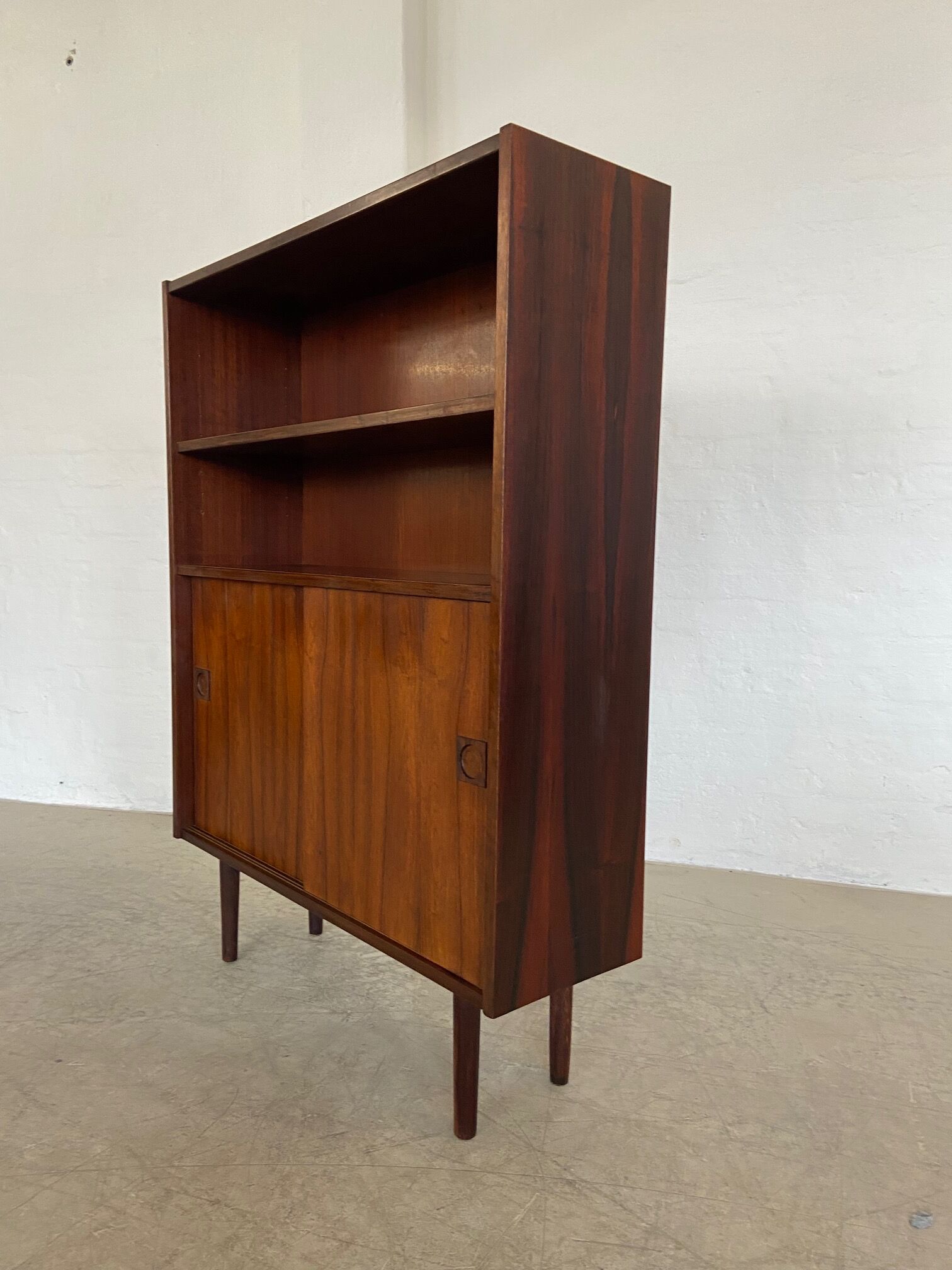 Danish retro vintage library in rosewood with sliding doors from the 1960s.