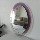 Vintage oval plexiglass mirror from the 70s by Harvey Guzzini