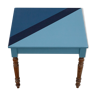 Wooden desk table with blue-shaped design