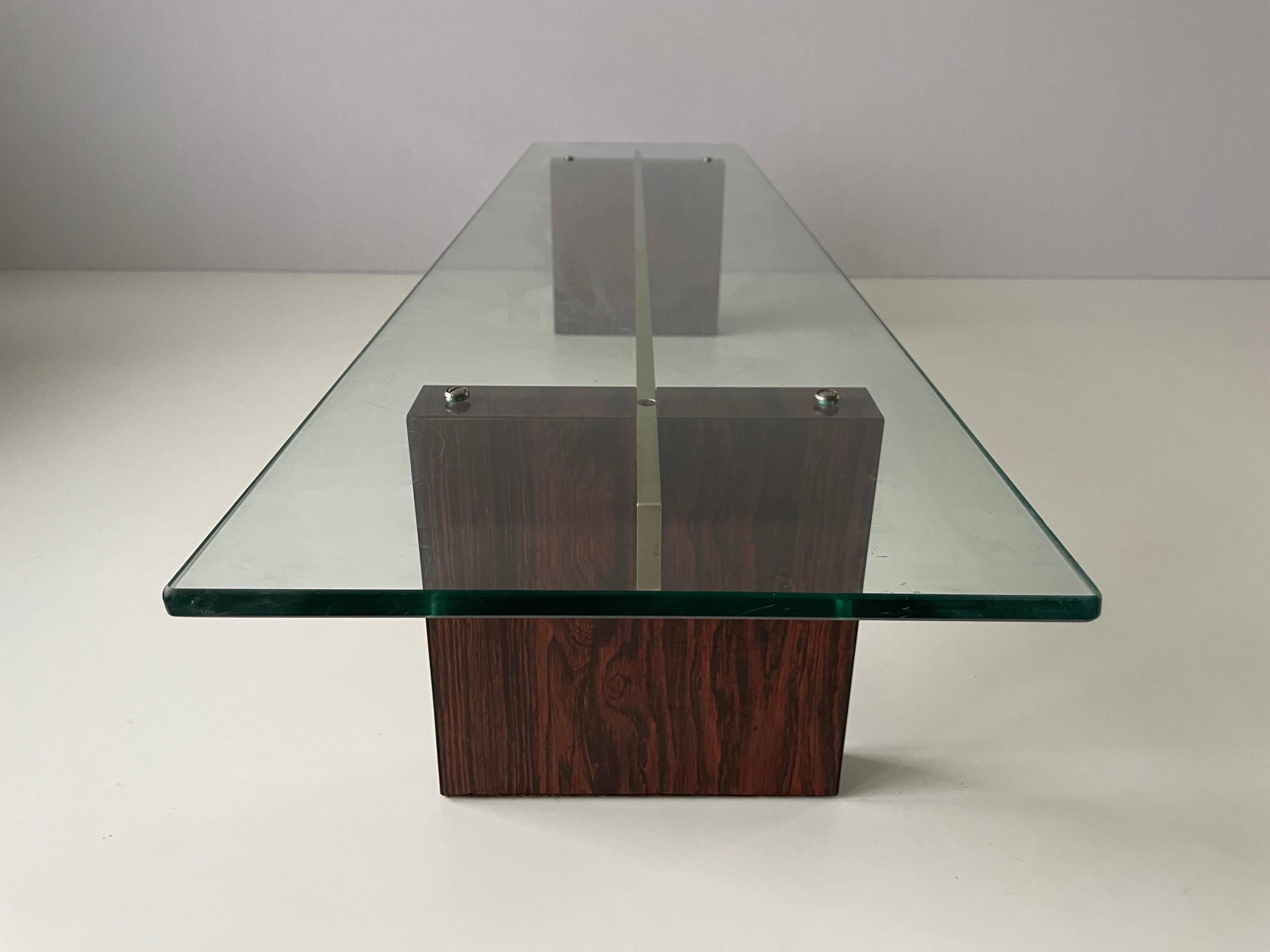 Mid-century minimalist thick glass coffee table, rosewood legs, 1960, Germany.