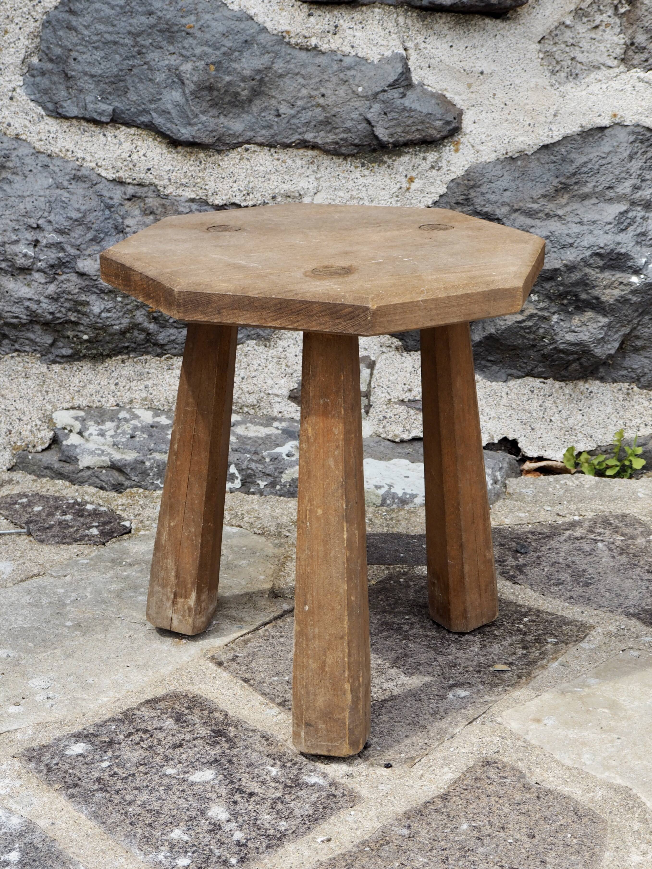 Raw wood tripod stool with octagonal seat