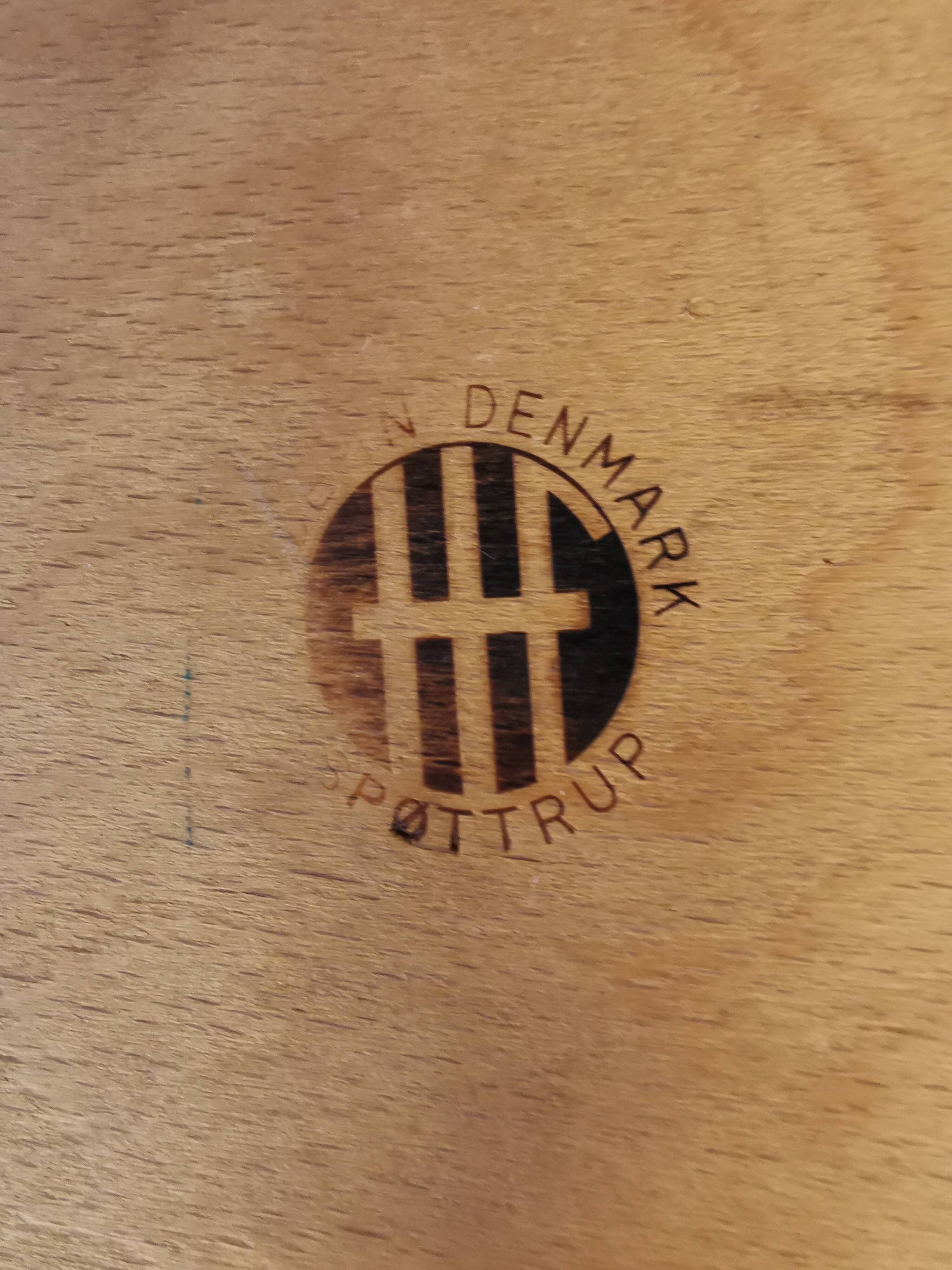 Danish designed footstool, in teak and black skai. Made at Spøttrup furniture factory in the 1960s.