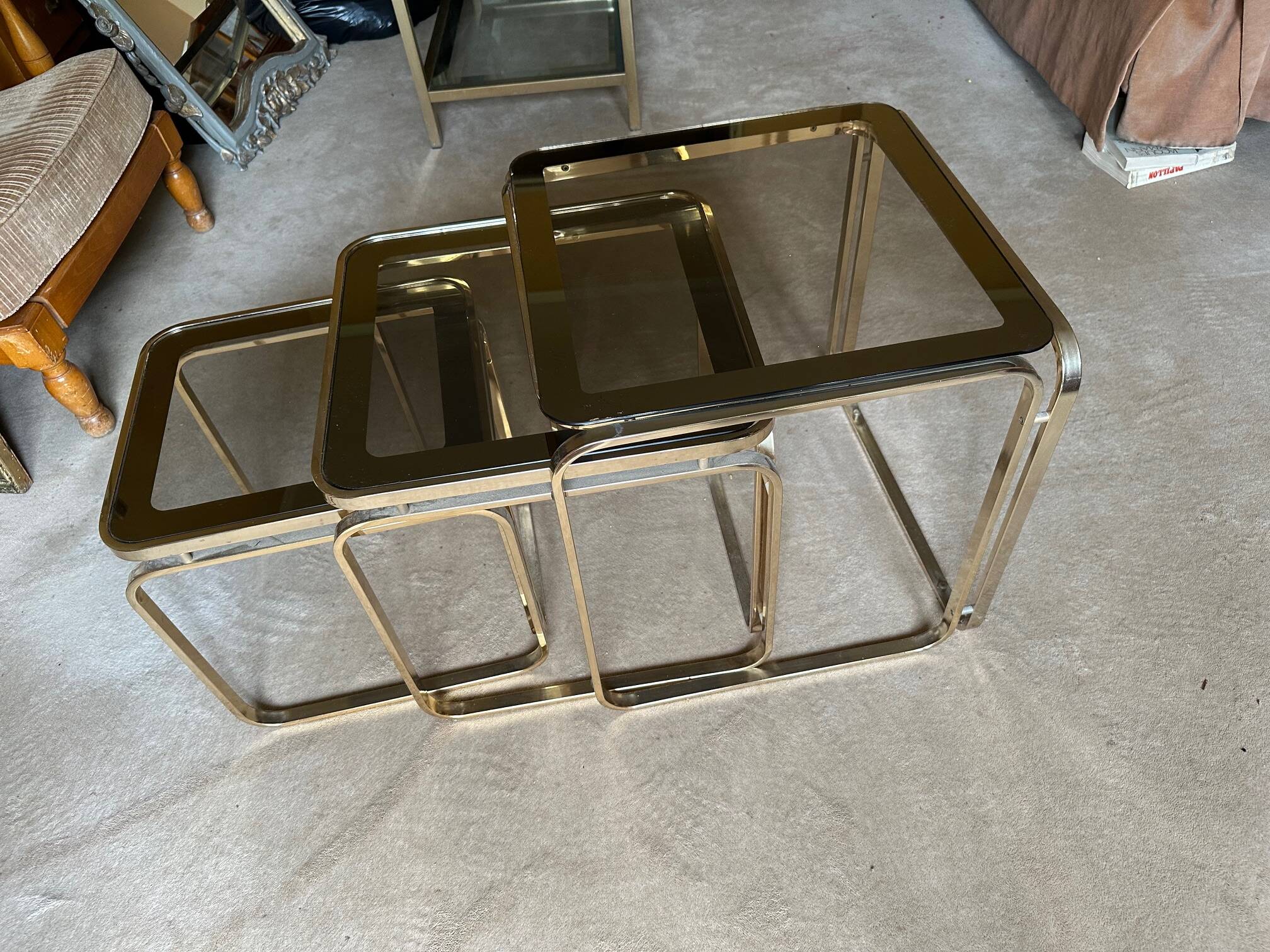 Brass nesting tables with smoked glass tops