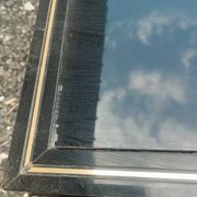 Vintage metal coffee table with glass top.