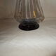 Dark purple glass wine carafe with a stopper.
