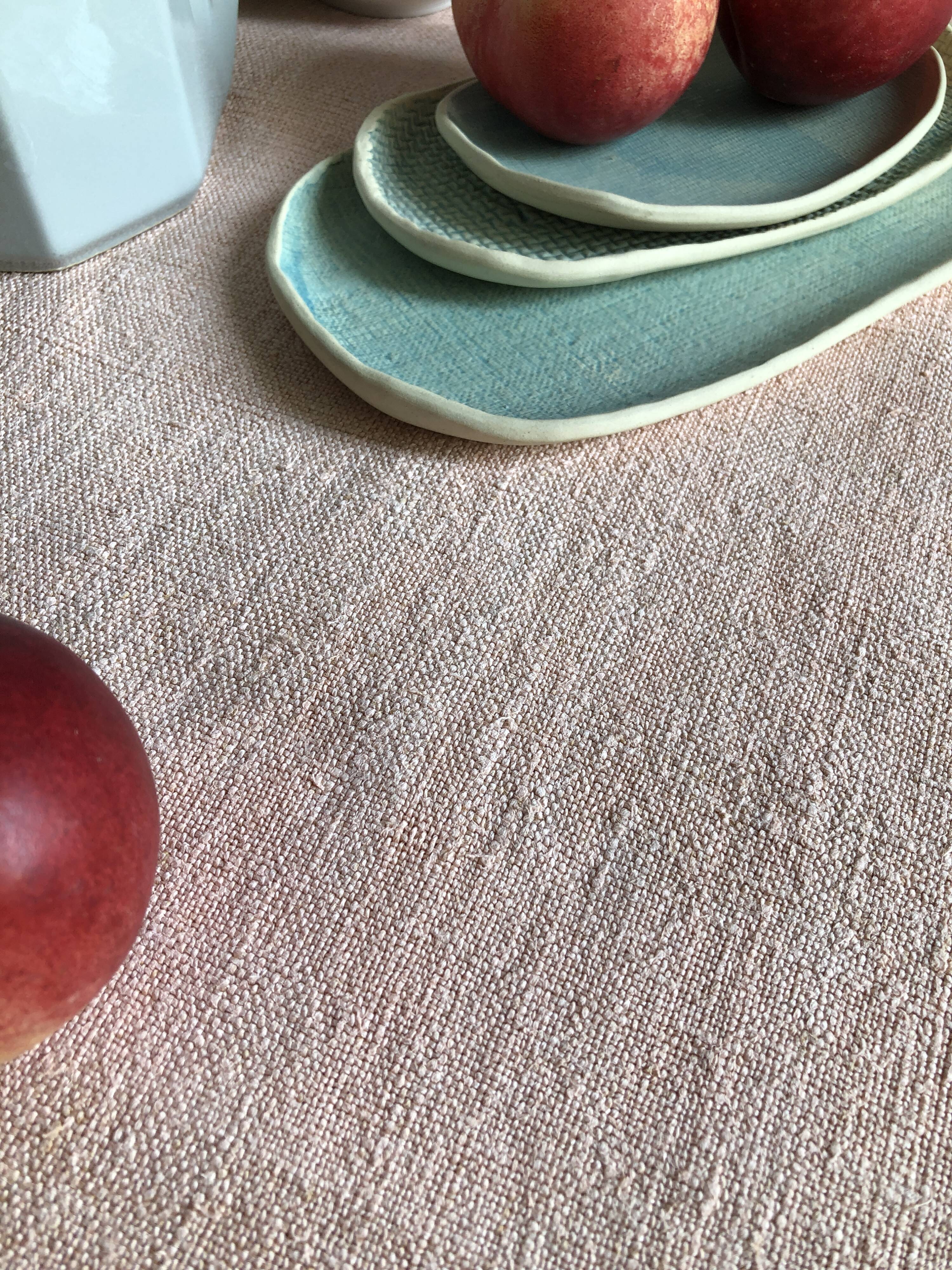 Old hemp harvest tablecloth tinted in pink tea