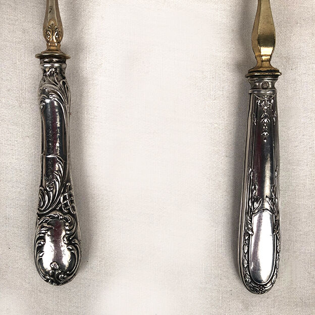Set of three silver metal service cutlery