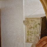 Free form mirror in golden wood