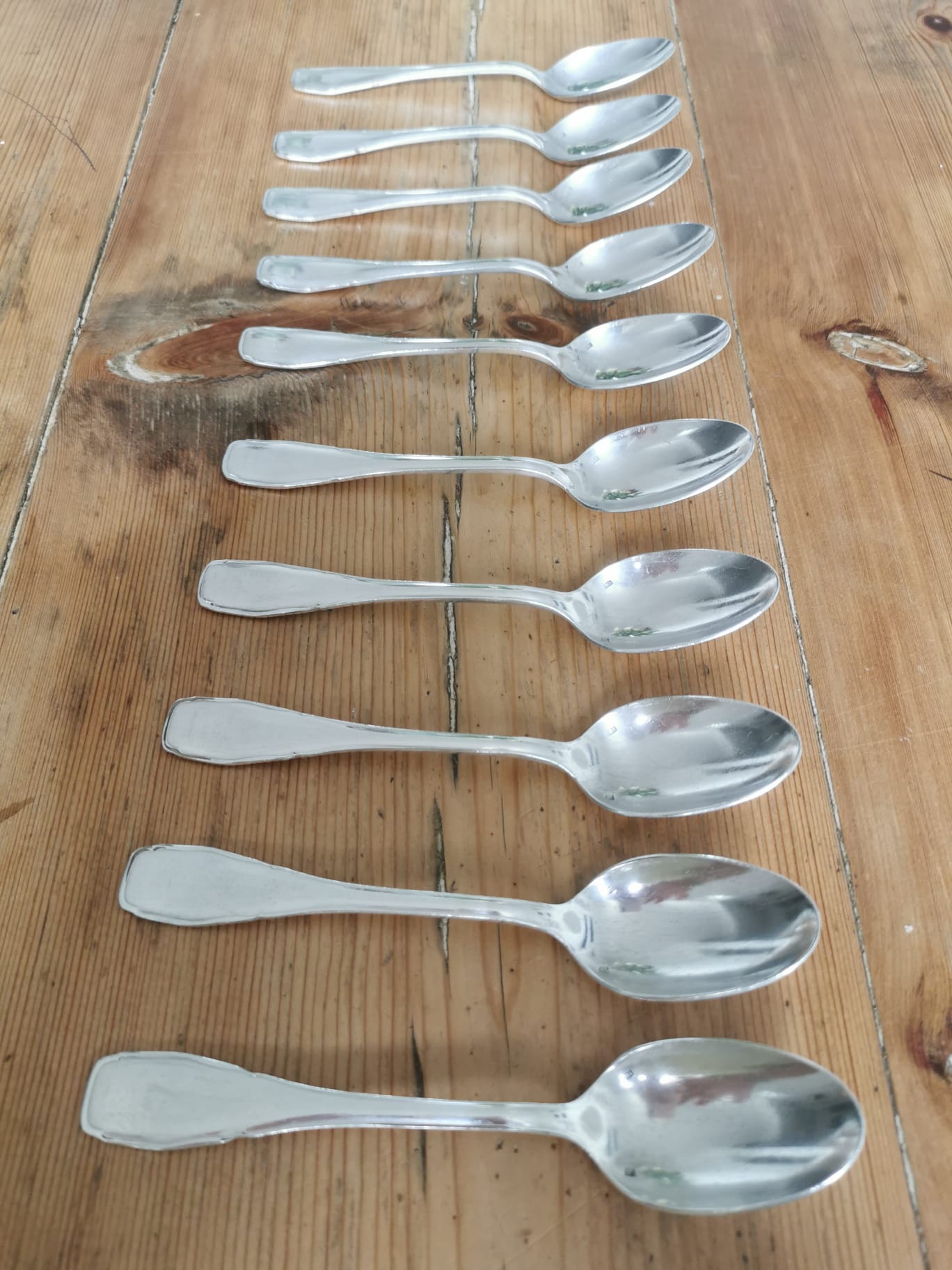 Set of 10 small silver metal spoons