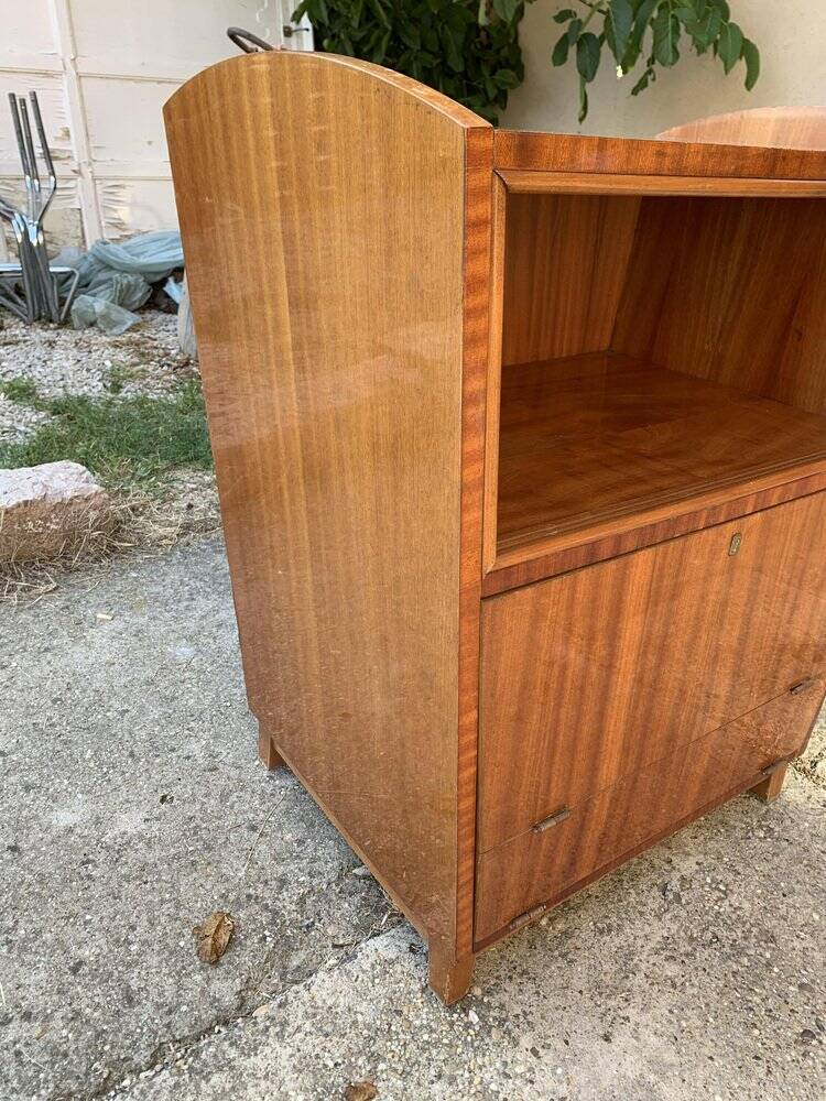 Brown trapezoidal wooden bar cabinet from the 1960s with a niche and lockable flap.